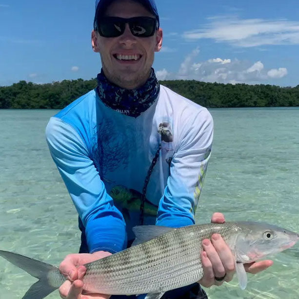 Man holding fish he just caught